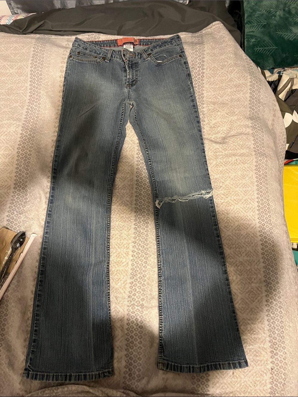 Women's Boot Cut Jeans in Faded Blue with Knee Distress
